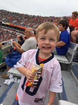 kid at a college football game as his non toy present