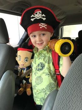 young kid dressed as pirate toy as part of a non toy gift idea of a 529 donation